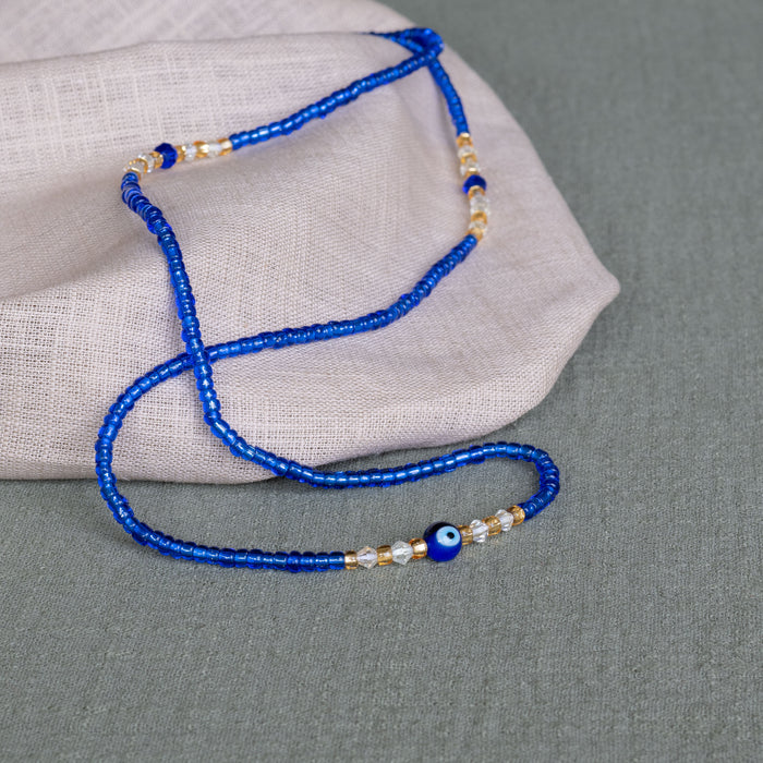blue evil eye waist beads – handmade Ghanaian body jewelry by Tòma Lina