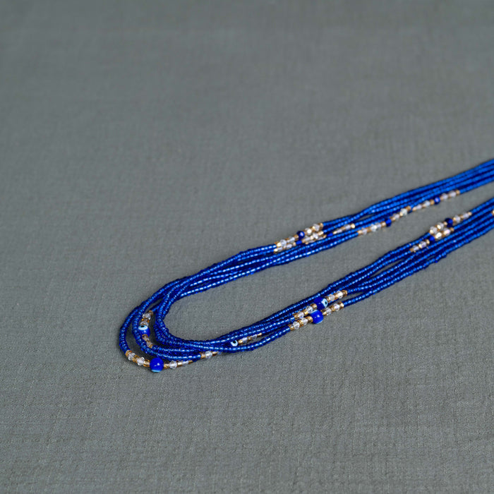 blue evil eye waist beads – handmade Ghanaian body jewelry by Tòma Lina