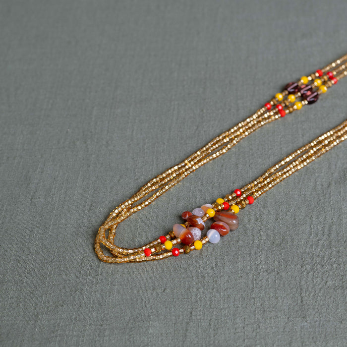 Gemstone waist beads in gold tones– handmade Ghanaian body jewelry by Tòma Lina