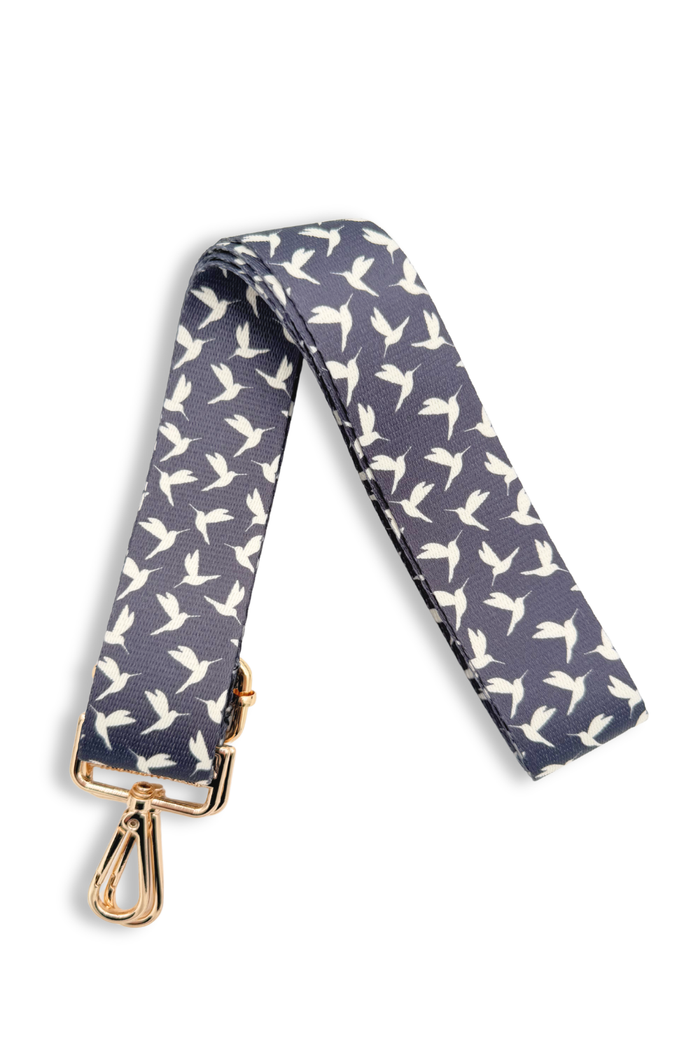 Hummingbird-patterned strap with gold clasp on a white background