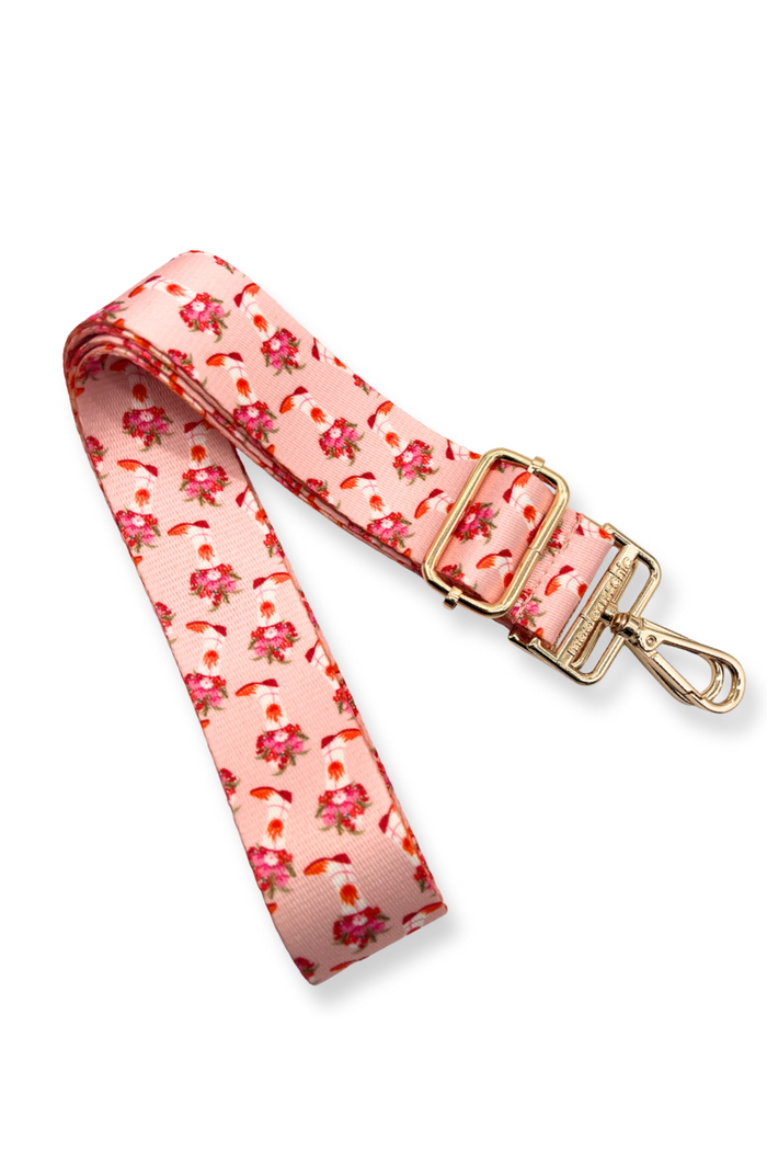 Floral and cowboy boot-patterned strap with a gold clasp on a white background
