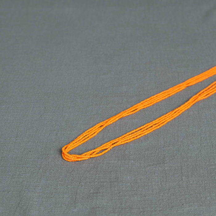 Pumpkin spice waist beads in orange – handmade Ghanaian body jewelry by Tòma Lina