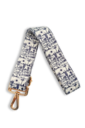 Black and white desert-patterned strap with a gold clasp on a white background