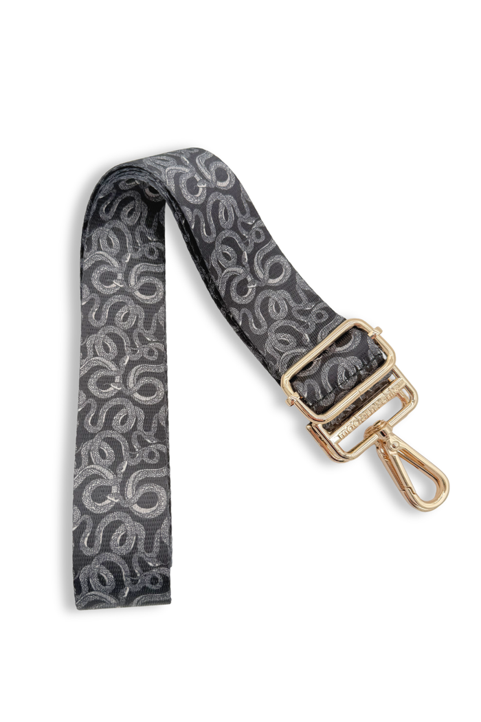 Twisted serpent-patterned strap with a gold clasp on a white background
