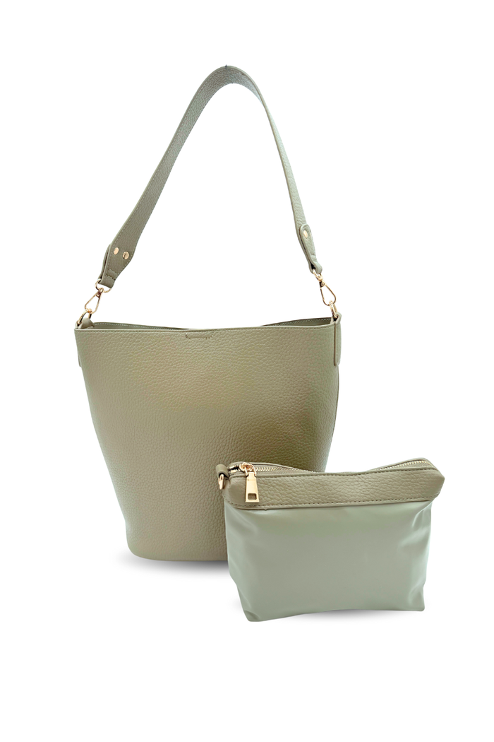 A green Modern+Chic vegan leather Sophie Bucket Bag and coordinating zipper pouch for Women –  on a white background.