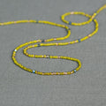 Yaa waist beads in yellow tones - handmade Ghanaian body jewelry by Tòma Lina